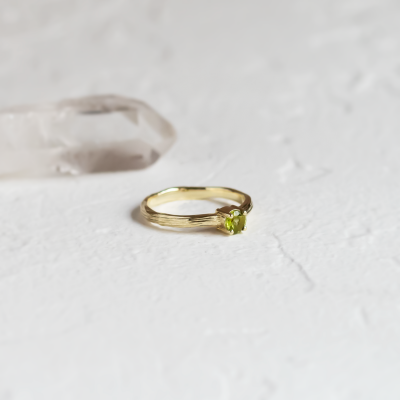 Gold ring in tree bark shape with peridot OLIVE