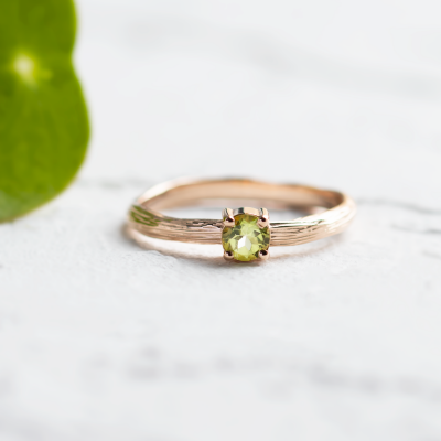 Gold ring in tree bark shape with peridot OLIVE