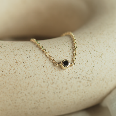 Gold bracelet with a black diamond BALA