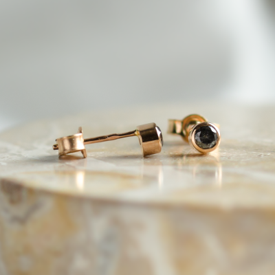 Minimalist gold earrings with salt and pepper diamonds in bezel setting NOLA