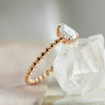 Gold engagement ring with beaded ball setting and pear moissanite BEAU