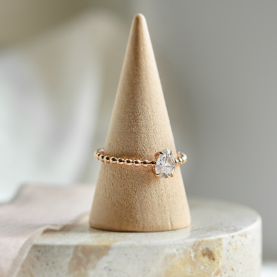 Gold engagement ring with beaded ball setting and pear moissanite BEAU