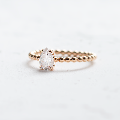 Gold engagement ring with beaded ball setting and pear moissanite BEAU