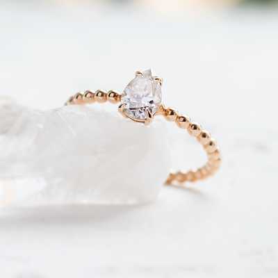 Gold engagement ring with beaded ball setting and pear moissanite BEAU
