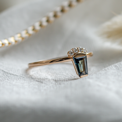 Unusual gold ring with teal sapphire and side diamonds AZRAQ