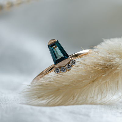 Unusual gold ring with teal sapphire and side diamonds AZRAQ