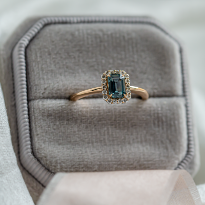 Halo gold ring with teal baguette sapphire and diamonds CELADON