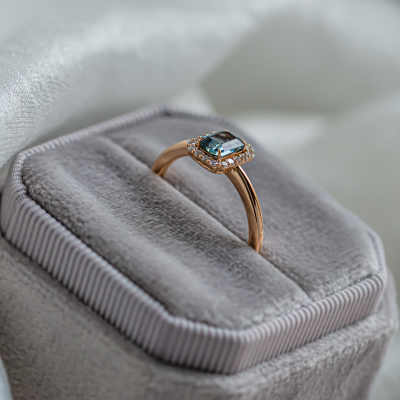 Halo gold ring with teal baguette sapphire and diamonds CELADON