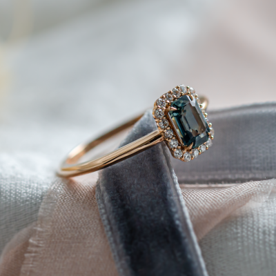 Halo gold ring with teal baguette sapphire and diamonds CELADON