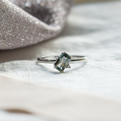 Gold ring with radiant teal sapphire and side diamonds JOY