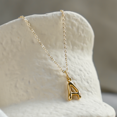 Gold letter pendant with diamond JEAN