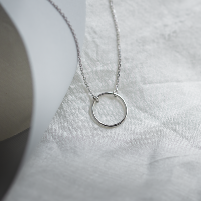 Gold minimalist necklace with a circle KARMA
