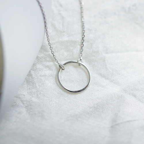 Gold minimalist necklace with a circle KARMA