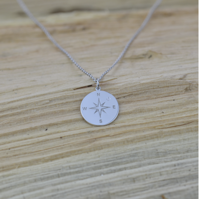 Silver pendant with a compass and a diamond MAP