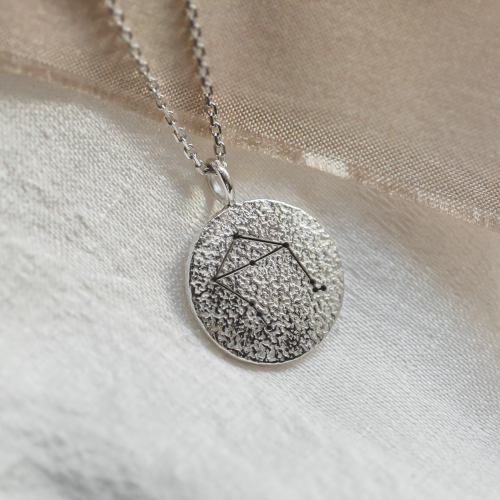 Gold necklace with zodiac sign and unusual surface NALA