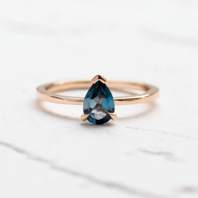Gold ring with london blue topaz DROP