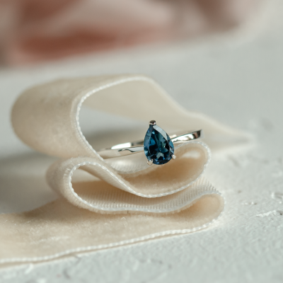 Gold ring with london blue topaz DROP