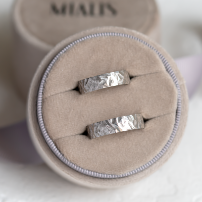 Gold wedding rings with a relief surface FIO