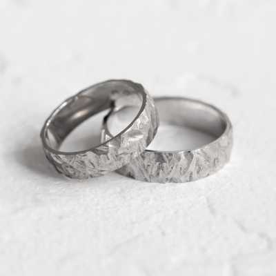 Gold wedding rings with a relief surface FIO