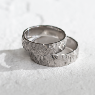 Gold wedding rings with a relief surface FIO