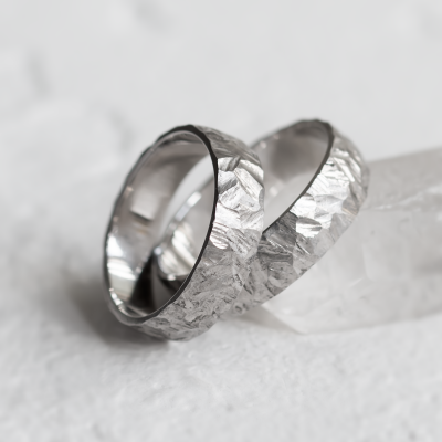 Gold wedding rings with a relief surface FIO