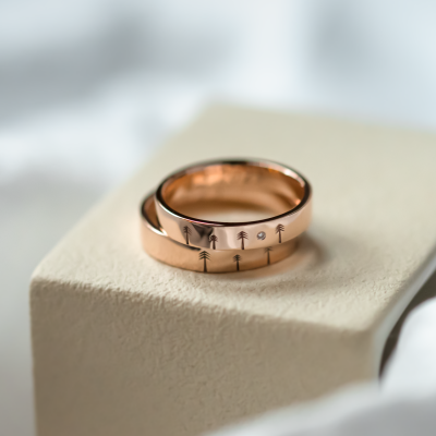 Gold wedding rings with engraved trees FORI