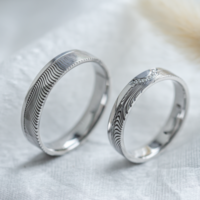 Wedding rings with abstract relief and diamonds OMEGA