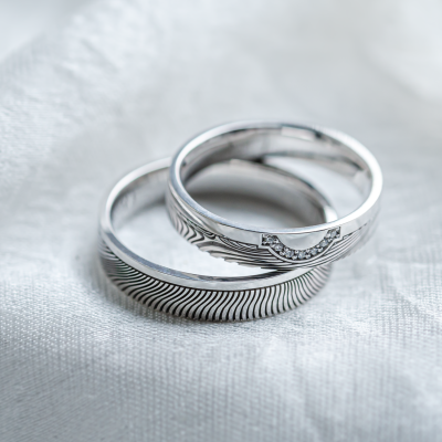 Wedding rings with abstract relief and diamonds OMEGA