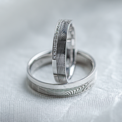 Original wedding rings with relief and diamonds PEACOCK