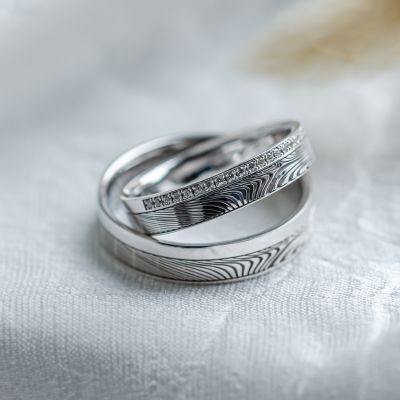 Original wedding rings with relief and diamonds PEACOCK