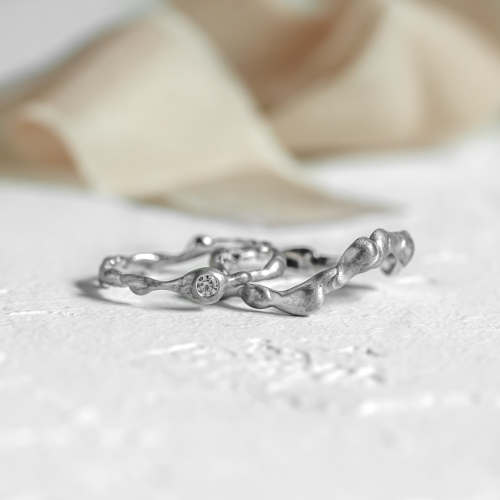 Curved wedding rings with diamond STIBI